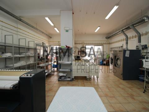 Laundry and building for sale in popular residential area.